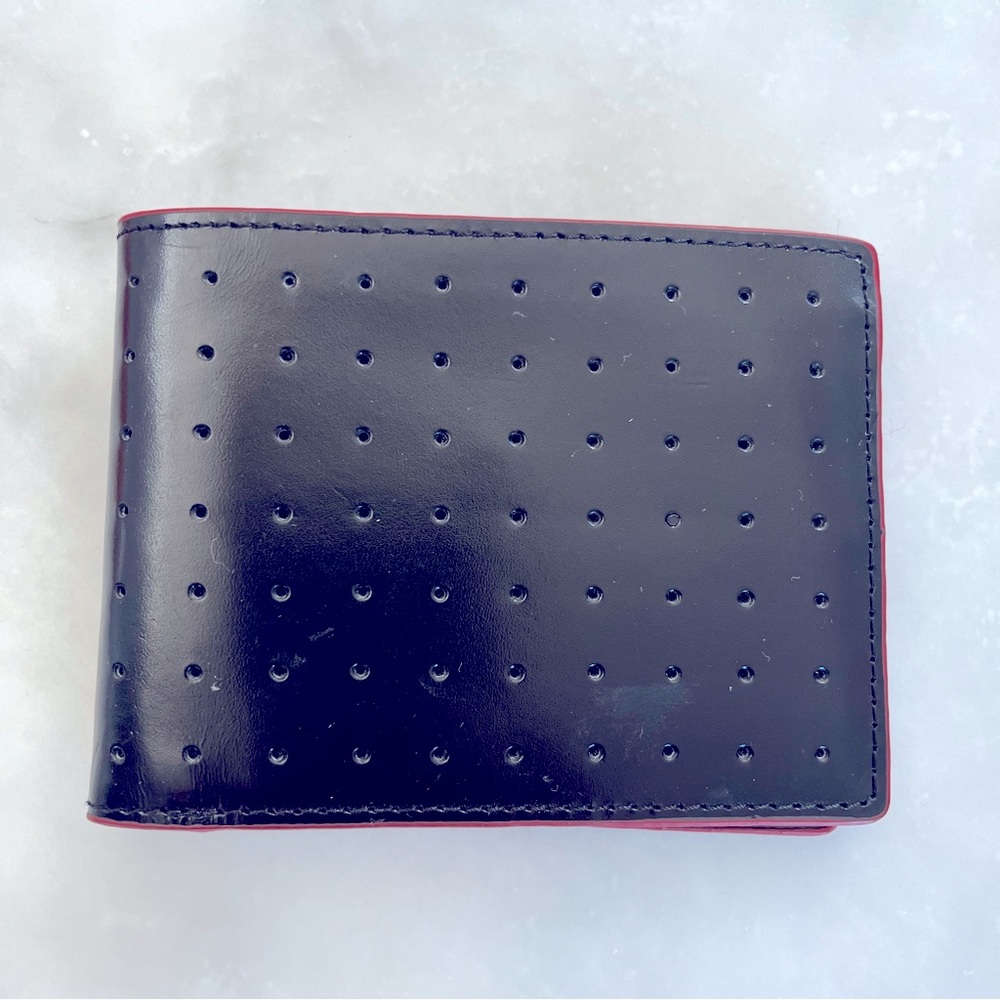 Black and red faux leather wallet.
